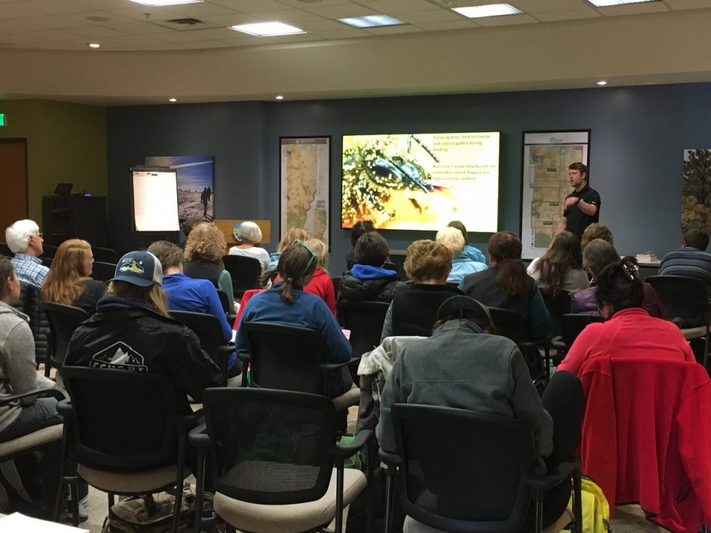 Dr. Seth Davis presenting local pollinator information to a group of volunteers.