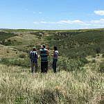 Interns Riley and Neal with volunteer Lexie take in the beauty of Coyote Ridge.