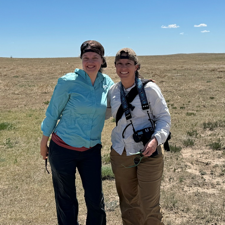 Photo of field biologists in rural grasslands in Colorado.